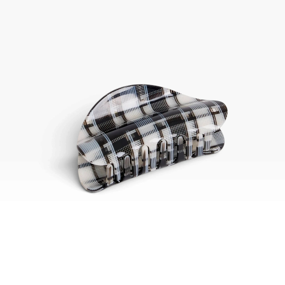 Chunky black-and-white plaid claw clip with ridged grip teeth