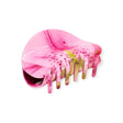 Pink lily-patterned claw hair clip with gold-toned teeth and hinged clasp