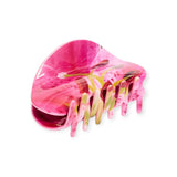 Pink floral claw hair clip with long gold-toned teeth and curved open top