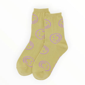 Crew socks in light yellow with purple smiley-face graphics, ankle height.
