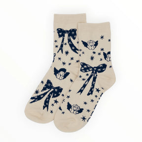 Baggu Crew Socks - Cherub Bows feature cream colors, charming floral and star patterns, and are crafted from a soft bamboo rayon blend.
