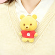 Yellow bear plush charm with red outfit and small button nose