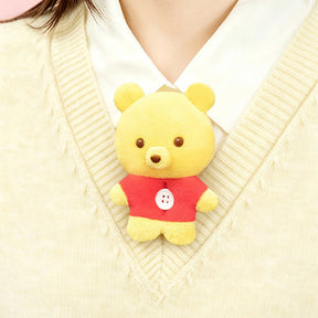 Yellow bear plush charm with red outfit and small button nose