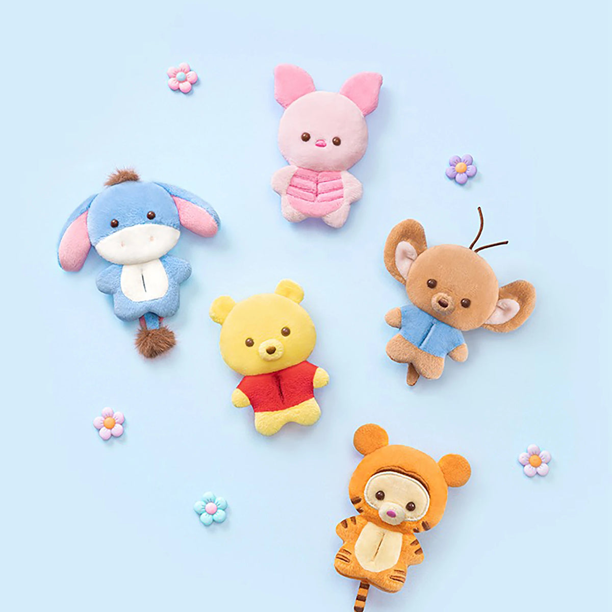 Five plush animal charms in assorted colors, including pink bunny and blue dog figures.