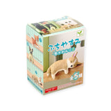 Introducing the Resting Dogs Blind Box - Vol. 2 by Yell, a delightful collection of collectible figurines known as Doggy Desk Buddies. Each features a small dog adorned with Japanese text and comes with a warning label for choking hazards. Suitable for ages 15 and up, you can collect all five charming breeds!