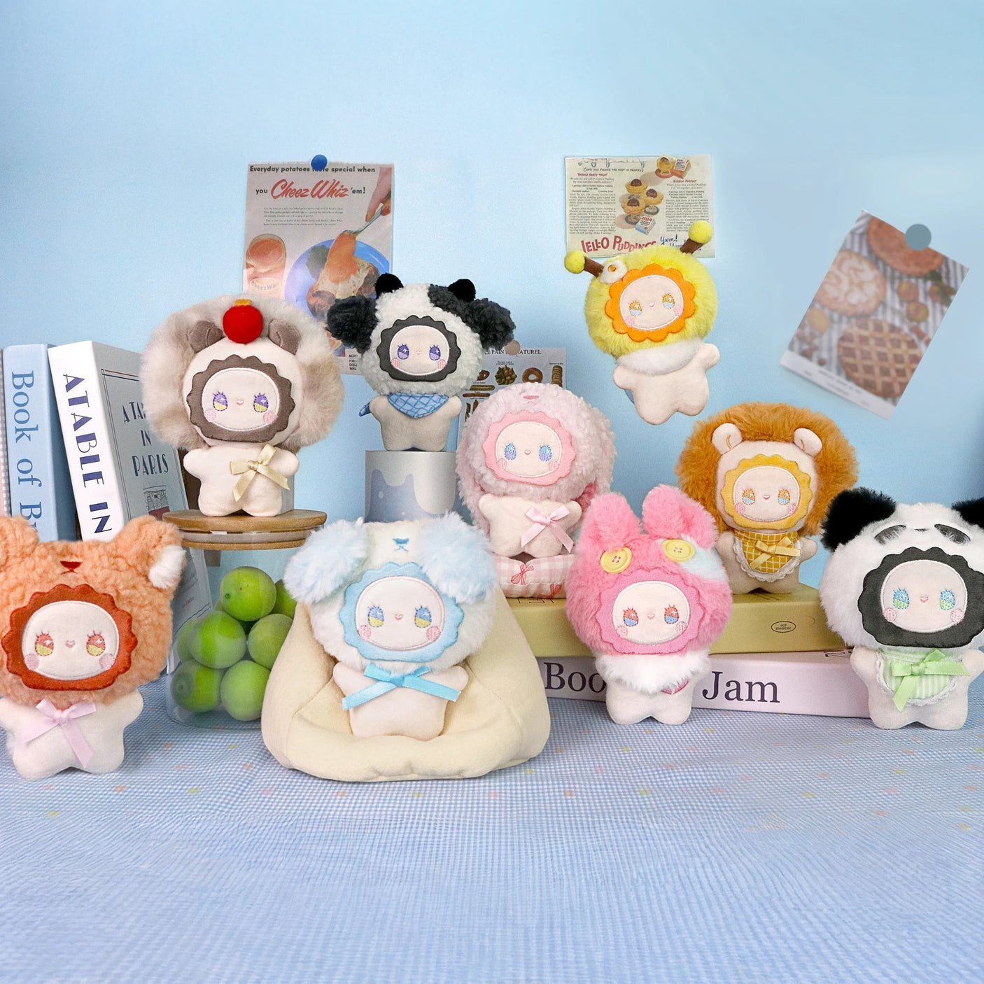 Fuzzy plush keychain figures in assorted colors, multiple gold key rings visible