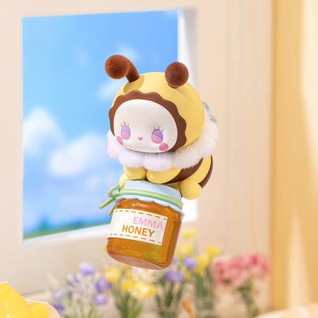 Cute Emma Secret Forest Love Dopamine Series figure dressed as a bee holding a jar of honey by the window