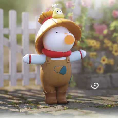 Charming Finding Unicorn REPOLAR Magical Garden figure wearing overalls and a sunflower hat with small bird outdoors