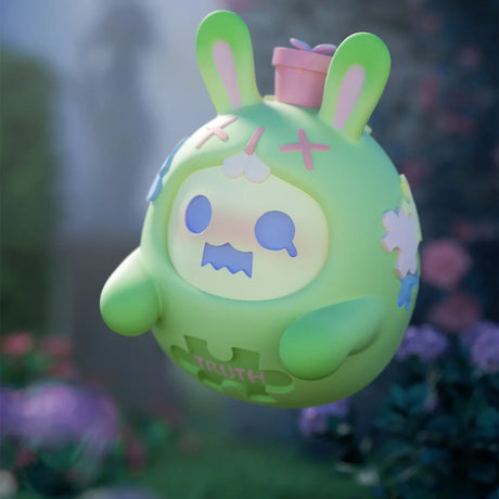 Mint green ShinWoo Secret Bear figure with bunny ears and puzzle piece details in soft garden setting