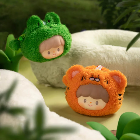 Two zZoton Forest Plush Pouches featuring characters in fluffy frog and tiger hood costumes on soft natural background