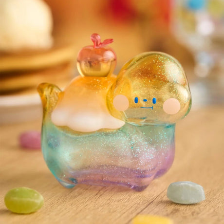 Close-up of translucent Food Dinosaur Fuji Yama Vol. 2 figure with apple and syrup details on wooden surface