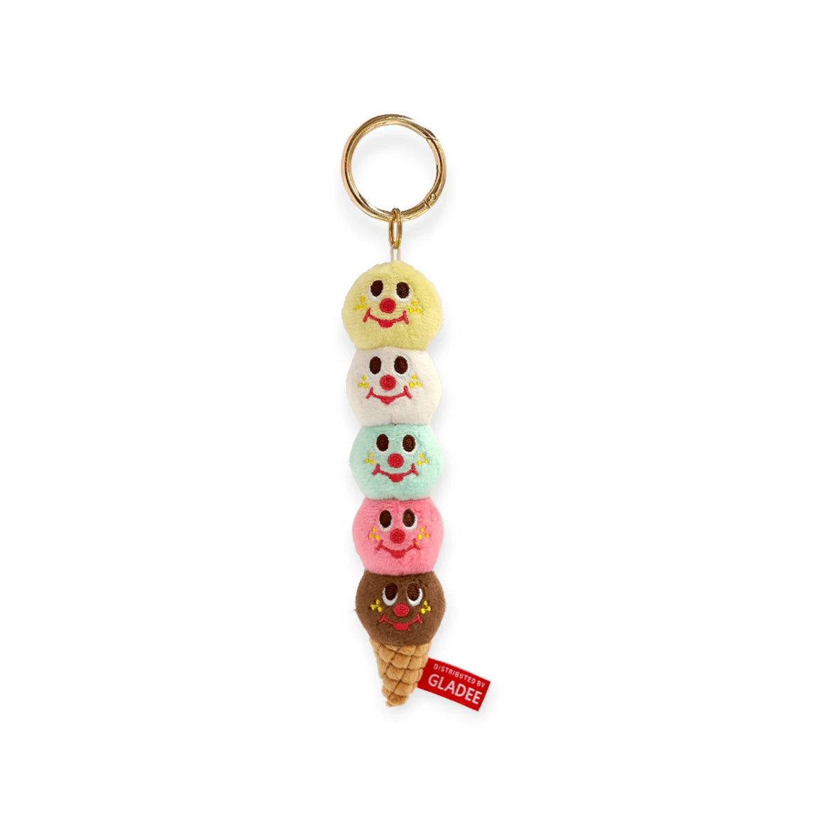 Five-scoop plush ice cream keychain with smiling faces on each scoop and gold ring