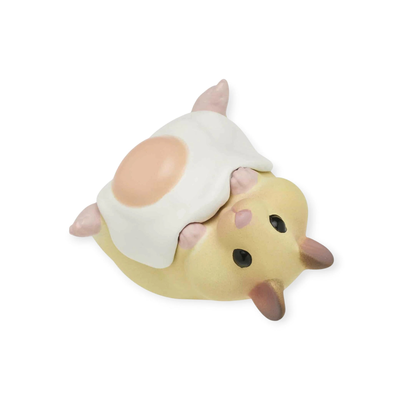 This delightful surprise figure from Kitan Club's Hamster ‘N Egg Blind Box series features a small hamster figurine lying under a fried egg blanket, perfect for your mini figure collection.