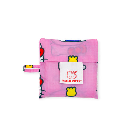 Folded Baby Baggu x Hello Kitty reusable bag in pink with Hello Kitty label, compact pouch front view, gallery image 1