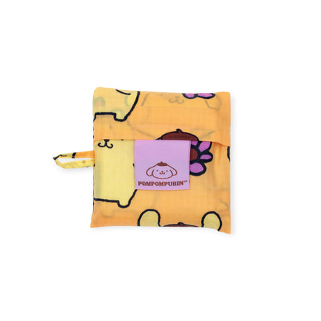 Folded Baby Baggu x Hello Kitty Pompompurin reusable pouch with orange background and purple flower, gallery image 1