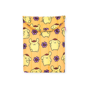 The Baggu Hello Kitty x Baggu Puffy Laptop Sleeve 13"/14” – Pompompurin features a playful yellow dog and purple flower pattern on an orange fabric pouch with flap, perfect for fans of Pompompurin.