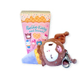 A plush keychain designed as an animal in the shape of an ice cream cone rests alongside a vibrant box from the "Hello Kitty & Friends - Ice Cream Blind Box" series by Sanrio, featuring charming cartoon ice cream characters.