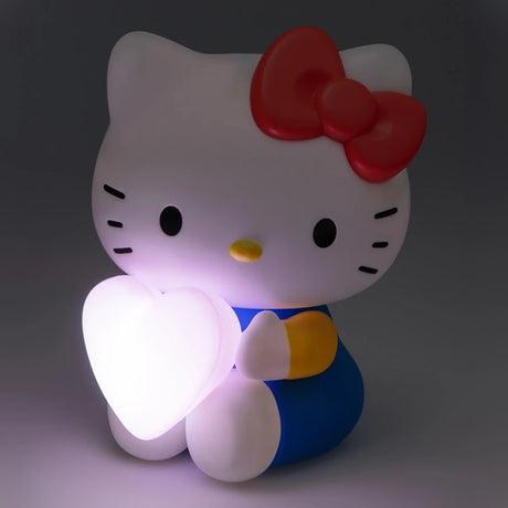 The Hello Kitty Night Light (16cm) features an adorable figure embracing a radiant pink heart, casting a charming and warm glow throughout the room.