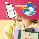 Hello Kitty Hippers mini figure attached to notebook while a hand holds a phone