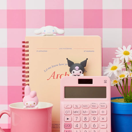 Sanrio Hippers mini figures on desk items, including a pencil cup and notebook