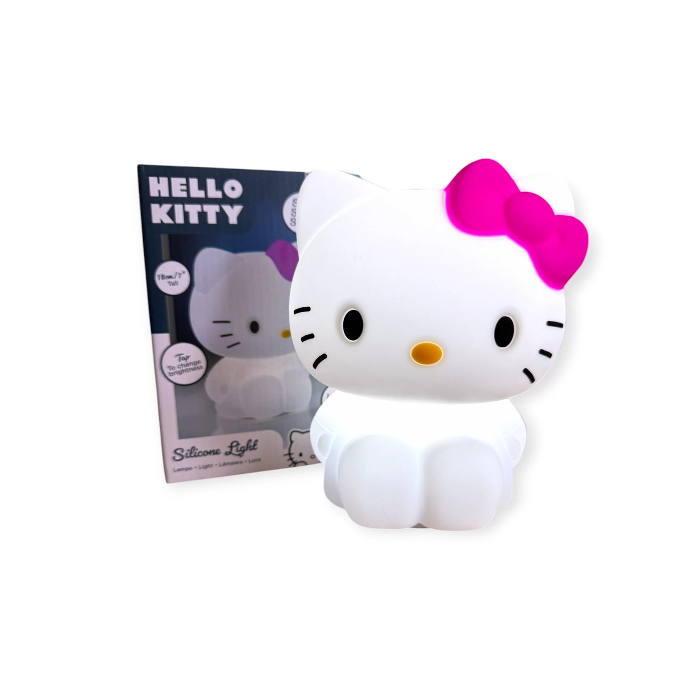 The Hello Kitty Silicone Night Light, featuring a pink bow, sits in front of its "Silicone Light" packaging box. This charming squishy night light adds whimsical appeal to any room.