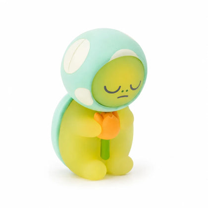 Light blue and yellow turtle blind box figure with peach slice accessory