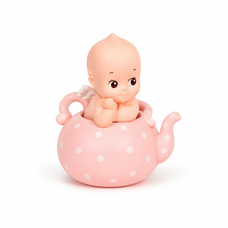 Kewpie baby figure in pink polka-dot teapot with white dots