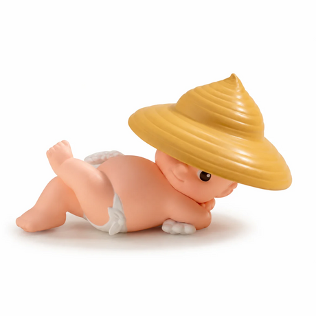 Kewpie blind box figure lying down with wide yellow hat and white shorts