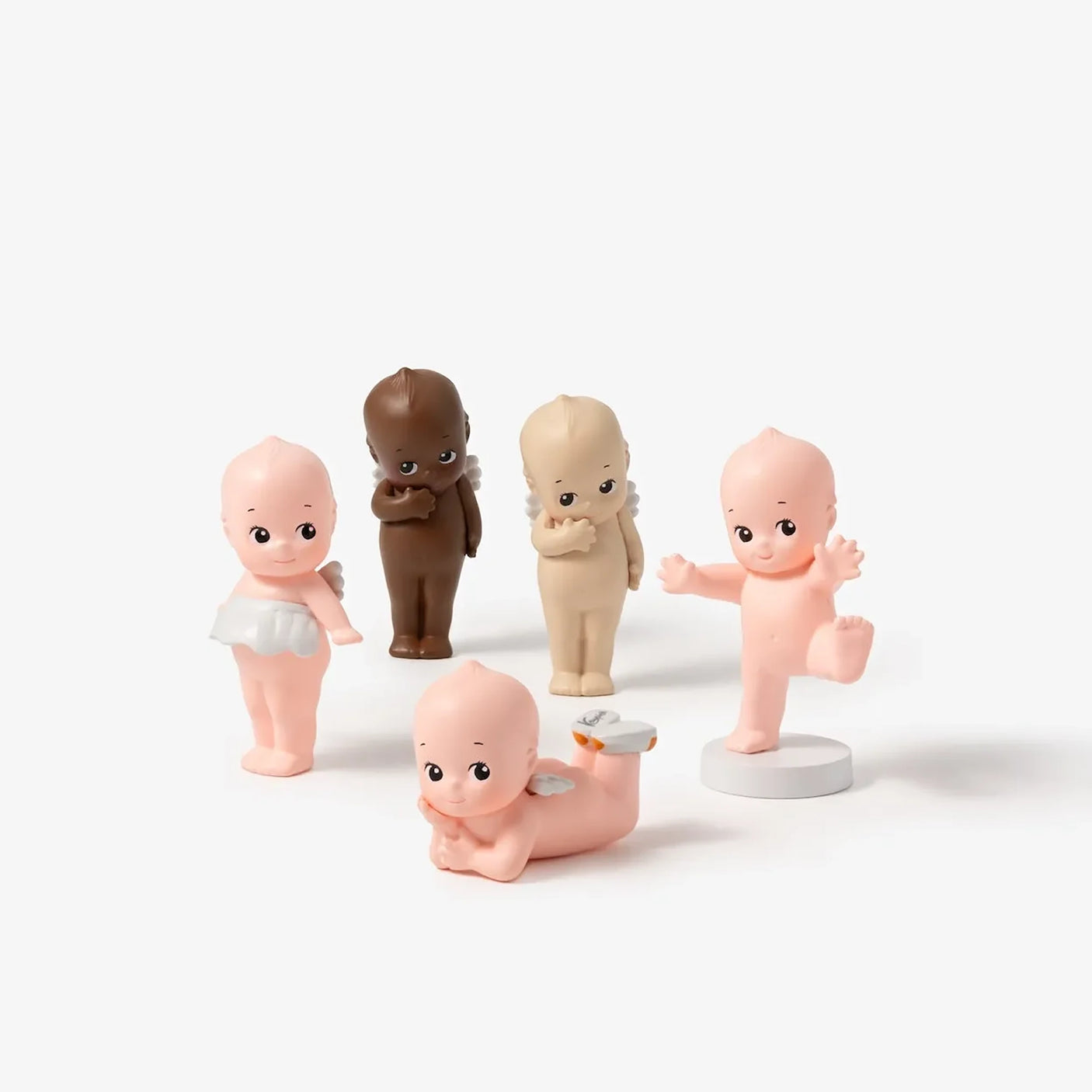 Mini blind box baby figure set with round bases, pink and brown versions