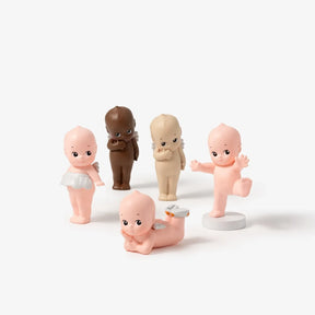Mini blind box baby figure set with round bases, pink and brown versions