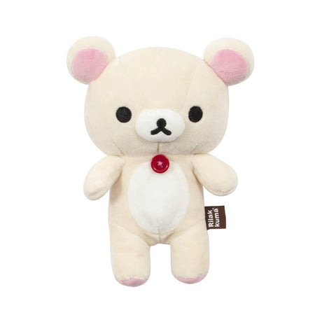 The Korilakkuma Small Plush - 20cm by Rilakkuma is a beige bear with pink ears, black eyes, a red chest button, and a “Rilakkuma” side tag, standing upright against a white background.