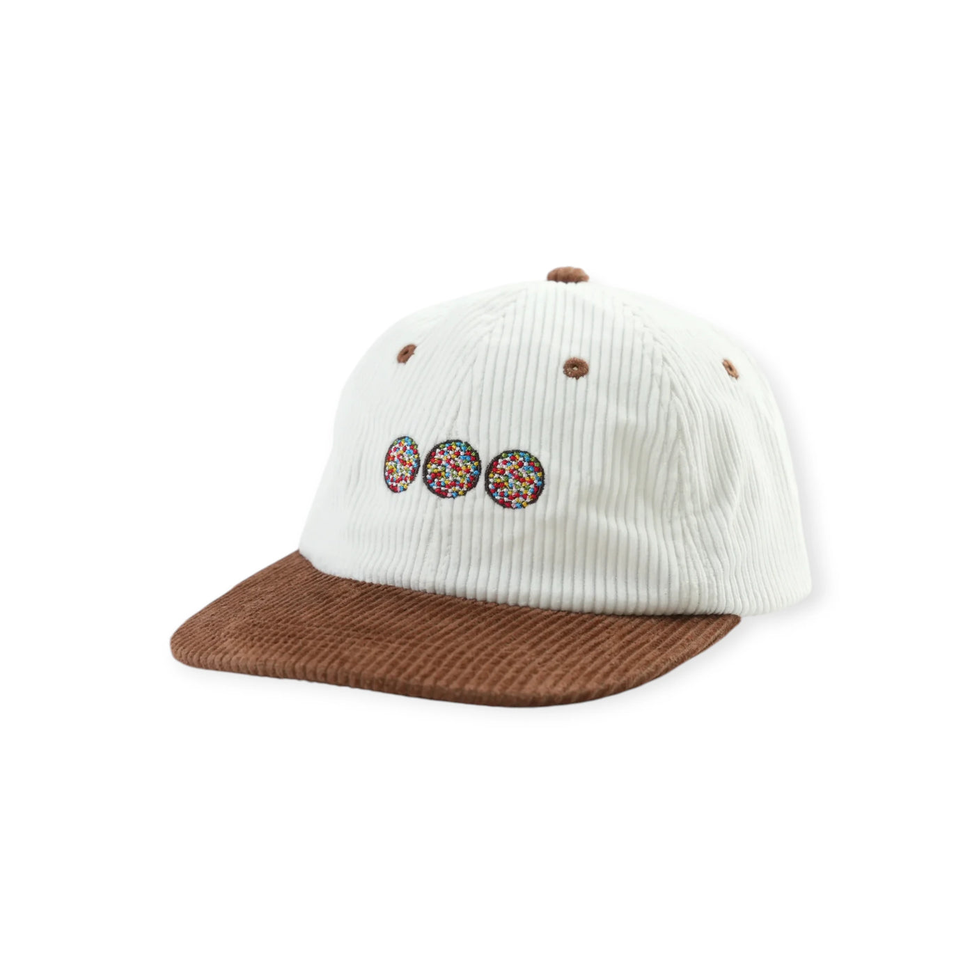 White corduroy cap with brown brim and three colorful circular embroidered designs on front panel
