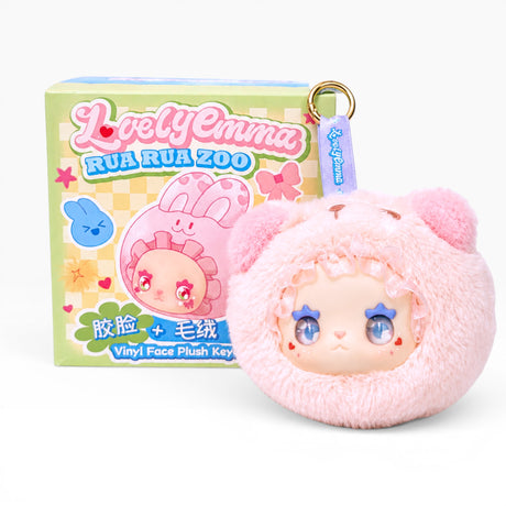 Pink plush bag charm with character face and gold keyring