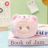 Soft plush Lovely Emma Rua Rua Zoo bag charm in pink bear costume with star-shaped blue eyes on pastel desk background
