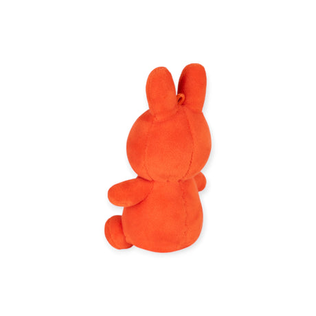 Back view of coral Mini Miffy Lucky Charm plush seated against white background in gift box gallery position one