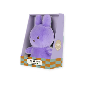 Front view of lilac Mini Miffy Lucky Charm plush seated in pastel purple gift box with label visible gallery position one