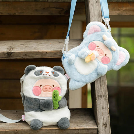 Two LuLu The Piggy Cross-body Bags displayed, one in panda costume with bamboo prop, and the other in blue koala outfit, duo view