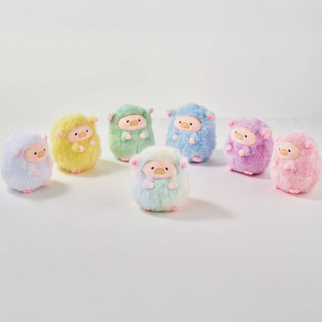 Seven LuLu The Piggy - Rainbow Sheep Plush Blind Box toys are arranged in a semi-circle. Each plush keychain comes in a unique pastel—blue, yellow, green, white, purple, or pink—from the LuLu The Piggy brand collection.