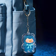 Blue mini teddy keychain case with clear charm and metal chain loop
