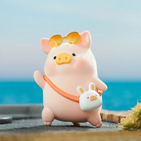 Chubby LuLu the Piggy figure with yellow sunglasses and white bunny bag standing by seaside under blue sky