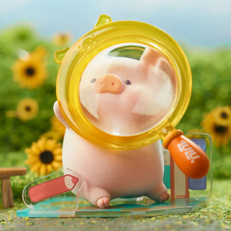 LuLu the Piggy figure peeking through a yellow travel-themed magnifying glass in a sunflower field setting
