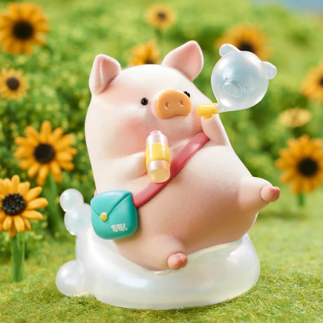Chubby LuLu the Piggy figure holding a drink and blowing a pig-shaped bubble, standing on clear bubble base outdoors