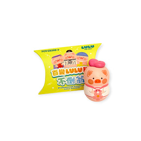 Yellow blind box package with pig desk wobbler figure, egg-shaped pig character