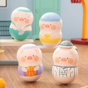 Four LuLu The Piggy desk wobblers dressed as basketball, baseball, swimmer, and bath duck, gallery position 1