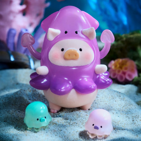 A LuLu The Piggy - Ocean Blind Box toy pig from LuLu The Piggy brand wears a purple squid outfit, stands on sand with two jellyfish, and is surrounded by coral and underwater scenery for a fun ocean adventure.