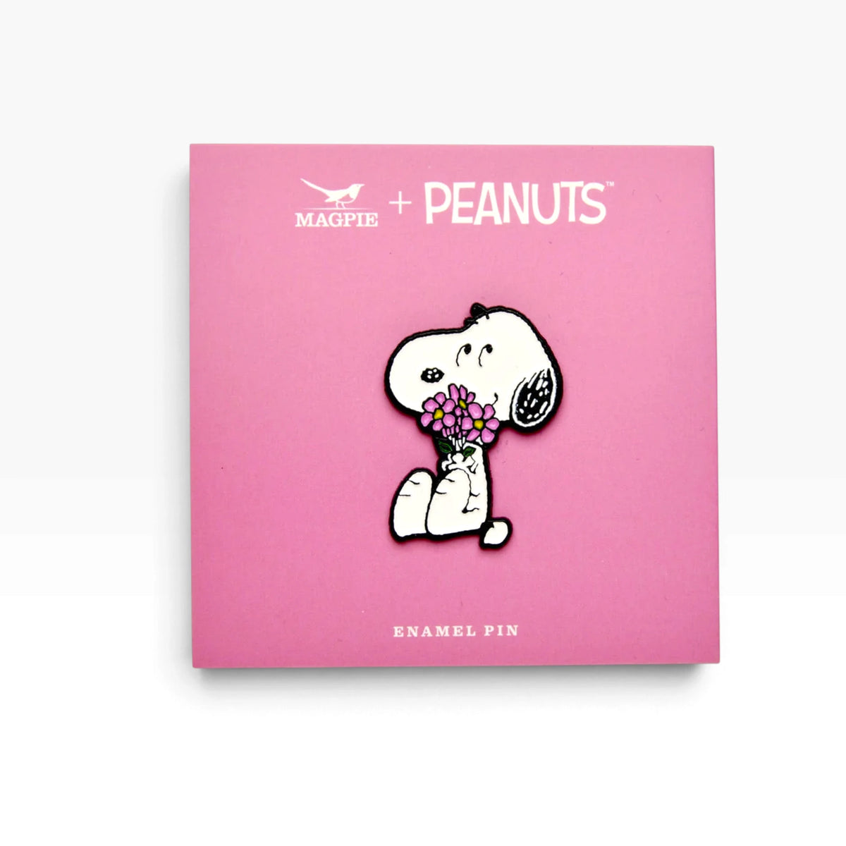 Snoopy enamel pin holding pink flowers on a card backing