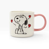 Cream ceramic Snoopy mug with pink handle, Snoopy sitting with red hearts