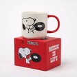 Snoopy ceramic mug with red handle, featuring Snoopy and a vinyl record graphic