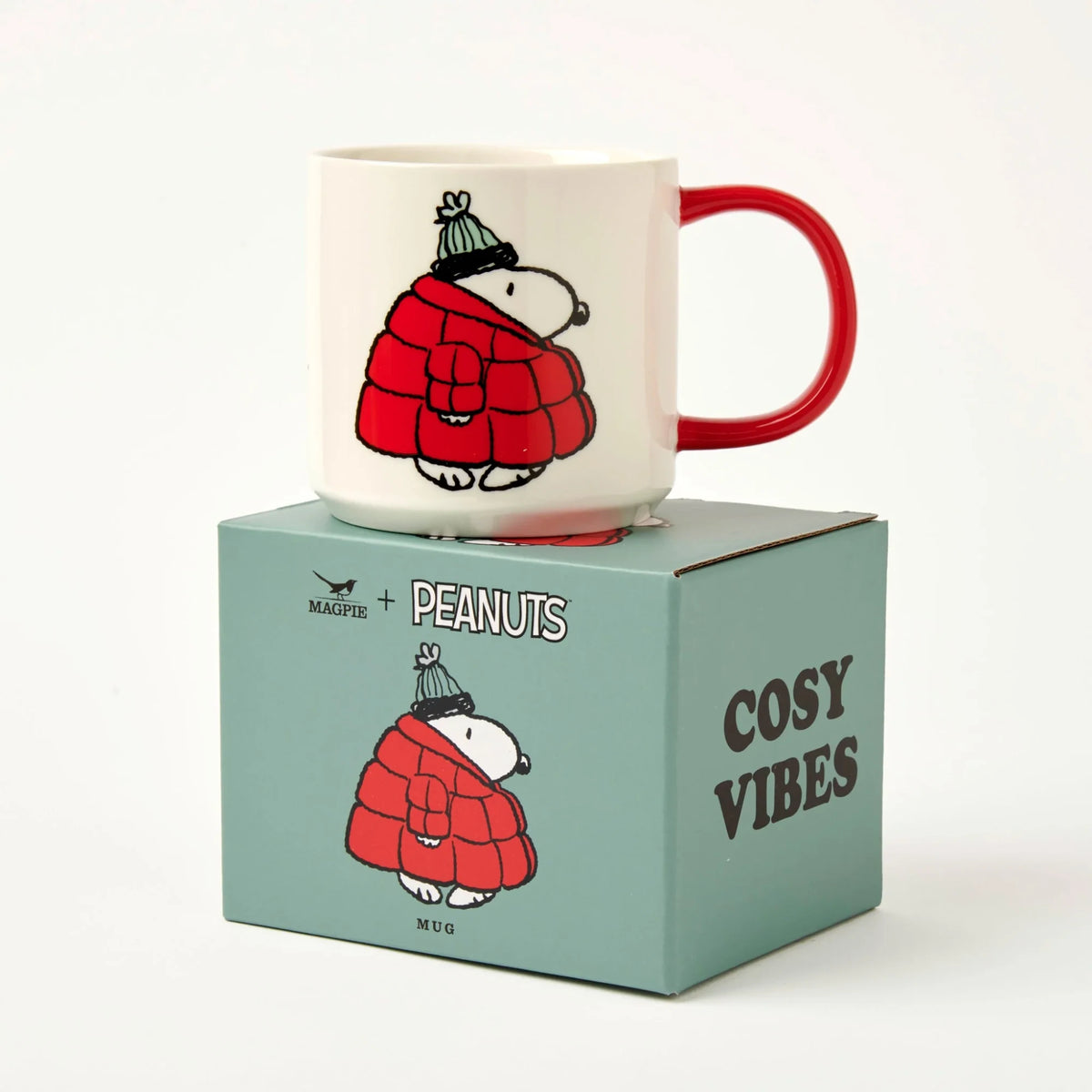 White Snoopy mug with Snoopy in red quilted jacket and red handle