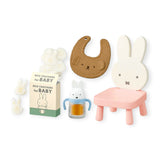Rabbit-themed seat and bath items with rice crackers box and small figures